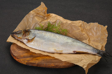 Salted herring over the wooden board