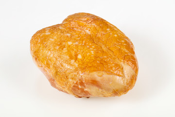 Smoked chicken breast over white background