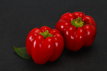 Ripe Red bell pepper over wooden