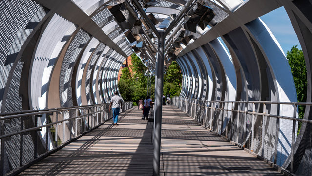 Madrid, Spain - June 2020:MODERN ,PERSPECTIVE METALIC BRIDGE DURING COVID-19  Arganzuela Bridge in Madrid RIO park on sunny day, Spain