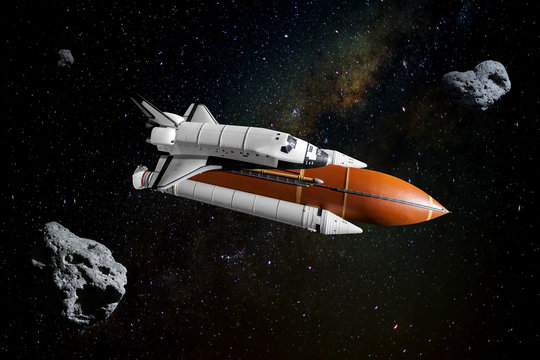 Space shuttle orbiting in  a space and starry background. Elements of this image furnished by NASA.