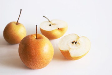 Chinese golden pears set Nashi variety isolated on white background two-round whole section half and slice. Food concept.Natural food. Fruit for juices and jellies.