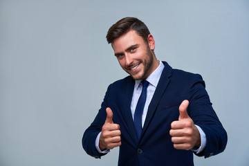 Close up portrait young man businessman. Caucasian guy business suit studio gray background.