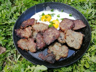 breakfast in a frying pan in nature fried eggs zalen meatballs potato pancakes potato pancakes meat beautiful