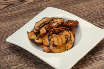 Roasted champignon with herbs and spices