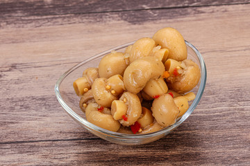 Pickled champignons in the bowl