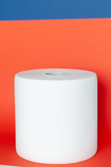 roll with paper towels on a colored background