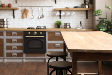 Empty wooden table in beautiful kitchen. Interior design