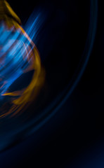 Macro shot of light bulb with abstraction lines on dark background