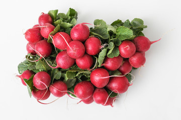 Red radishes isolated on white background