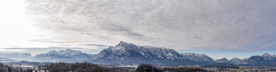 Panoramic aerial drone shot view of Austrian Alps snowy untersberg