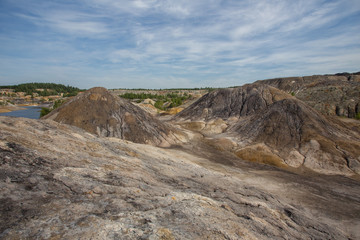 Amazing kaolin clay marsian landscape quarry open pit at summer day