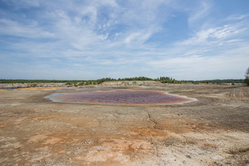Amazing kaolin clay marsian landscape quarry open pit at summer day