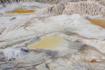 Amazing kaolin clay marsian landscape quarry open pit at summer day