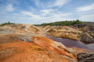 Amazing kaolin clay marsian landscape quarry open pit at summer day