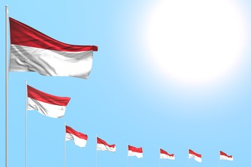 cute independence day flag 3d illustration. - many Monaco flags placed diagonal on blue sky with space for text