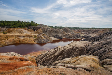 Amazing kaolin clay marsian landscape quarry open pit at summer day