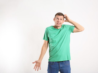 Fototapeta premium Emotional man in casual outfit on white background