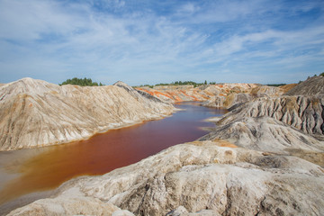 Amazing kaolin clay marsian landscape quarry open pit at summer day