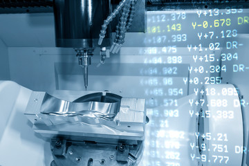 The abstract scene of 5 axis CNC milling machine cutting the automotive mold parts with solid ball endmill tools. The hi-technology automotive part manufacturing process by 5 axis machining center.