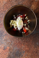 Fine dining, ice cream with elderflowers on chocolate mousse