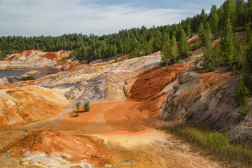 Amazing kaolin clay marsian landscape quarry open pit at summer day
