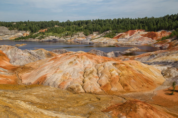 Amazing kaolin clay marsian landscape quarry open pit at summer day