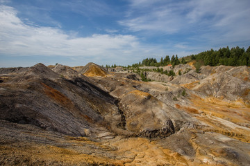 Amazing kaolin clay marsian landscape quarry open pit at summer day