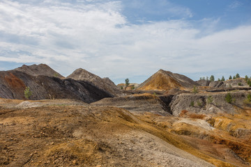 Amazing kaolin clay marsian landscape quarry open pit at summer day