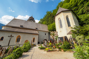 View of the cemetery surrounding the Roman Catholic Parish Church of Hallstatt, Salzkammergut region, O&Ouml;, Austria, with the famous charnel house