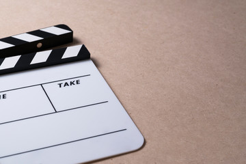 movie clapper on wood table ; film, cinema and vedio photography concept