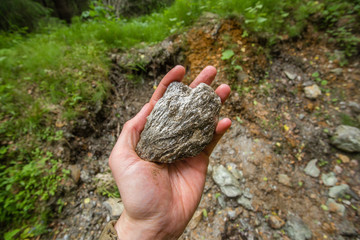 Emerald ore specimen nugget mineral in miners hand