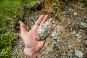 Emerald ore specimen nugget mineral in miners hand