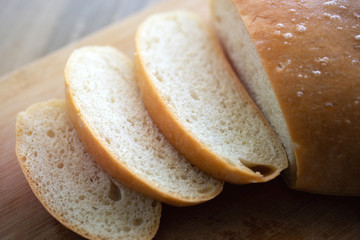 Close up background of sliced homemade round bread. 
