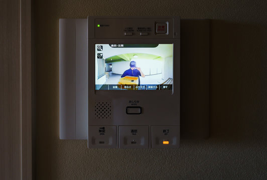 delivery person and door bell with intercom and camera