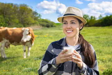 young woman drinking milk outdoors
