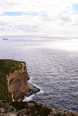 Huge waves crash on cloudy day. Kemmuna island