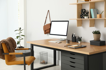 Fototapeta premium Stylish room interior with modern comfortable workplace