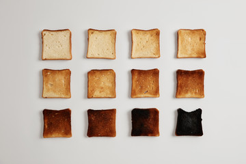 Pieces of bread browned as result of toasting. Delicious crust tender slices of bread prepared in...