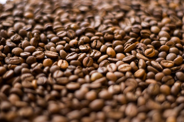 Lots of roasted coffee beans on a white background