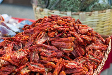 dried red tomatoes in a basket, closeup