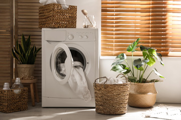 Stylish room interior with washing machine. Design idea