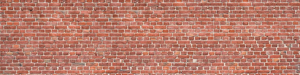 Panorama of an old red brick wall as a background or texture