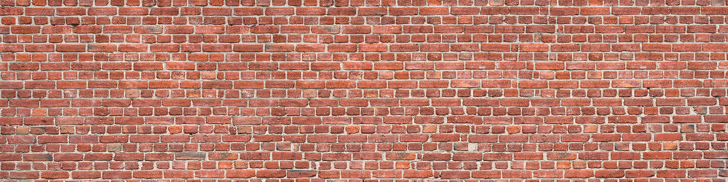 Fototapeta Panorama of an old red brick wall as a background or texture