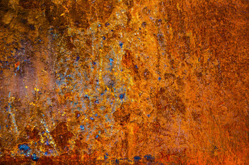 Rusted iron  texture with a little blue yellow and red paint