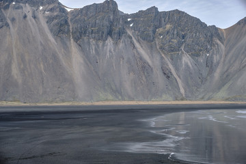 The Vestrahorn mountain on the Icelandic coast jut directly out of the ocean