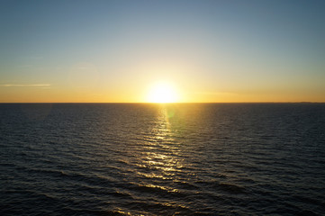 Sunset/sunrise on the ocean. Seen from a cruise