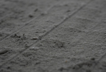 A sheet of panel filter of air condition with a lot of dust on white background.Dirty filter make more waste power consumption and It is accumulation of germs. Focus at center. 