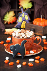 Halloween  time composition with cookies and hot chocolate mug