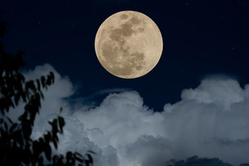 Full moon with clouds in night.